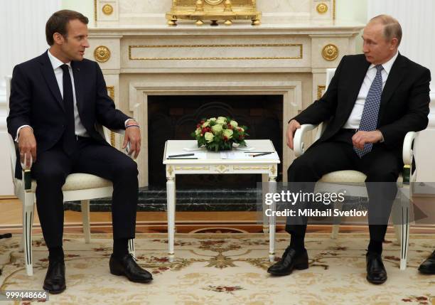 Russian President Vladimir Putin greets French President Emmanuel Macron during their talks at the Kremlin, in Moscow, Russia, July 15, 2018. Macron...