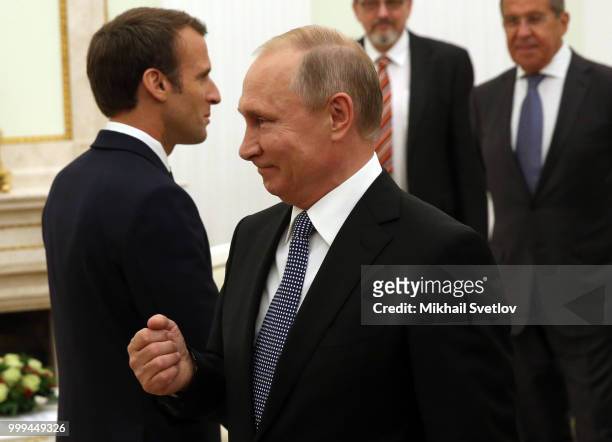 Russian President Vladimir Putin greets French President Emmanuel Macron during their talks at the Kremlin, in Moscow, Russia, July 15, 2018. Macron...