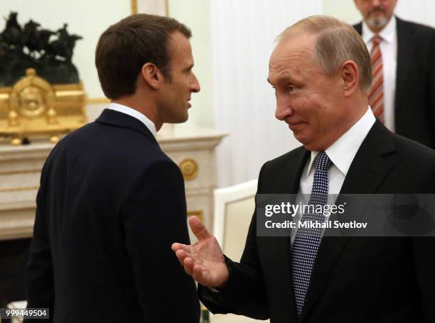 Russian President Vladimir Putin greets French President Emmanuel Macron during their talks at the Kremlin, in Moscow, Russia, July 15, 2018. Macron...