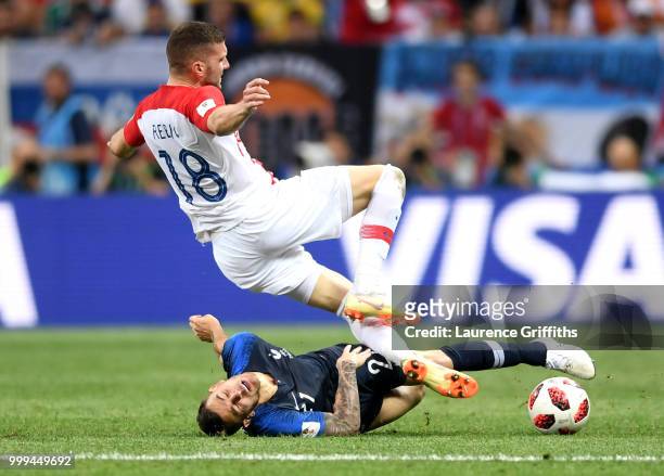 Lucas Hernandez of France tackles Ante Rebic of Croatia during the 2018 FIFA World Cup Final between France and Croatia at Luzhniki Stadium on July...