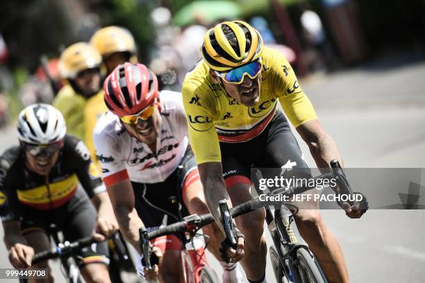 Belgium's Yves Lampaert, Germany's John Degenkolb and Belgium's Greg Van Avermaet, wearing the overall leader's yellow jersey, ride during the ninth...