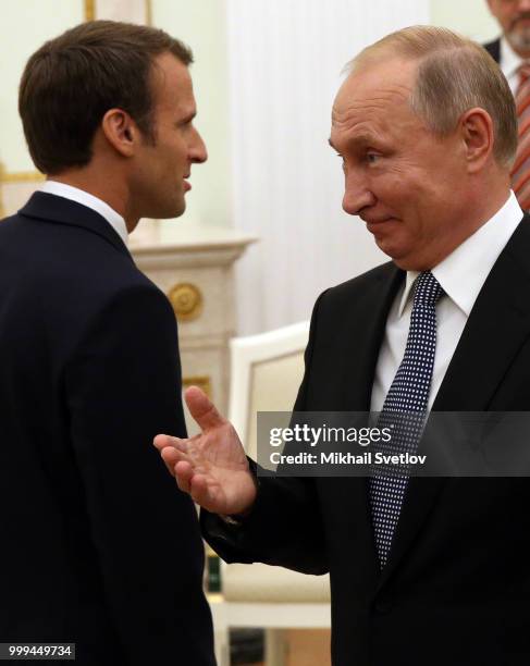 Russian President Vladimir Putin greets French President Emmanuel Macron during their talks at the Kremlin, in Moscow, Russia, July 15, 2018. Macron...