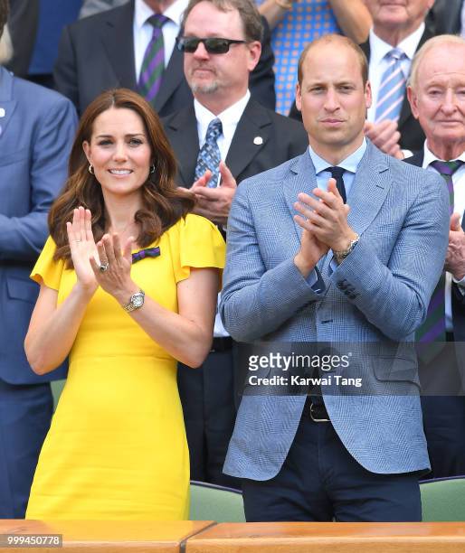 Catherine, Duchess of Cambridge, Prince William and Duke of Cambridge applaud during the men's singles final on day thirteen of the Wimbledon Tennis...
