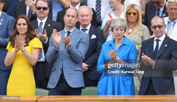 Catherine, Duchess of Cambridge, Prince William, Duke of Cambridge, Prime Minister Theresa May and Philip May applaud during the men's singles final...