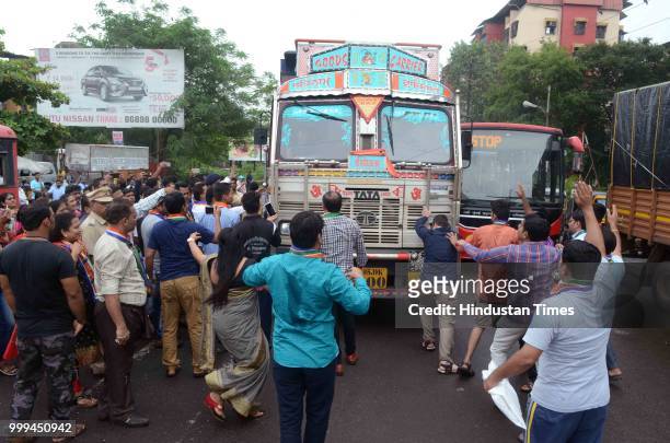 Party workers protest against Heavy Vehicles which entering in Kalyan city, near Patri Pool, on July 14, 2018 in Mumbai, India.