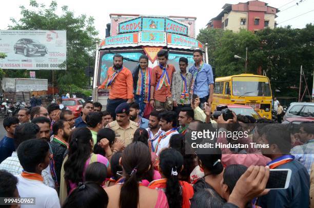 Party workers protest against Heavy Vehicles which entering in Kalyan city, near Patri Pool, on July 14, 2018 in Mumbai, India.