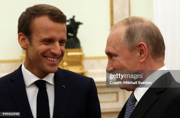 Russian President Vladimir Putin greets French President Emmanuel Macron during their talks at the Kremlin, in Moscow, Russia, July 2018. Macron has...