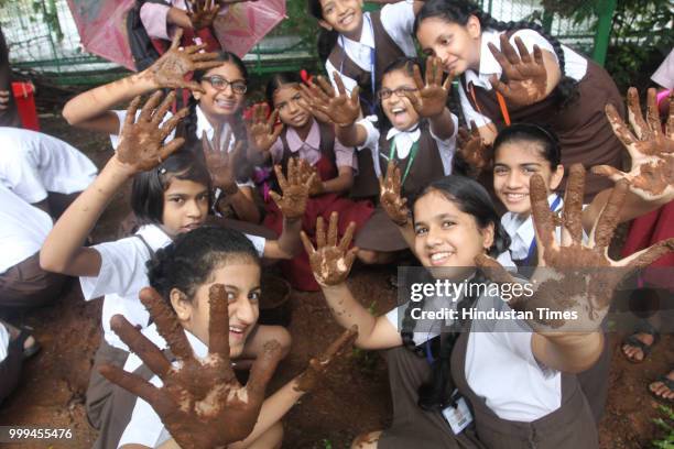 Students of Smt Sulochanadevi Singhania school plant trees in the school premises along with the students of Pandit School, a tribal school in Yeoor,...