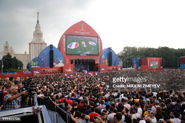 Giant screen shows the final match between France and Croatia at the fan Fest in Moscow before the Russia 2018 World Cup final football tournament on...