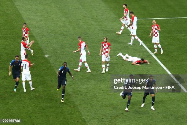 Players of France celebrate their team's first goal, an own goal by Mario Mandzukic of Croatia during the 2018 FIFA World Cup Final between France...