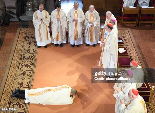 Peter Kohlgraf lies on the ground during the litany at his episcopal ordination in the Cathedral in Mainz, Germany, 27 August 2017. The 50-year-old...