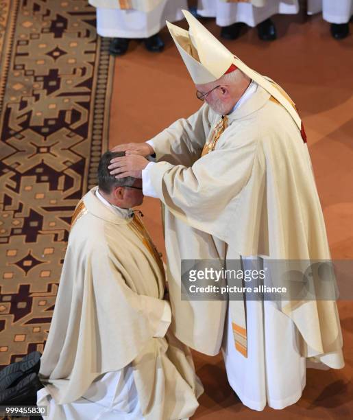 Peter Kohlgraf receives blessing from Cardinal Reinhard Marx, Archbishop of Munich and Freising and chairman of the German Bishop conference during...