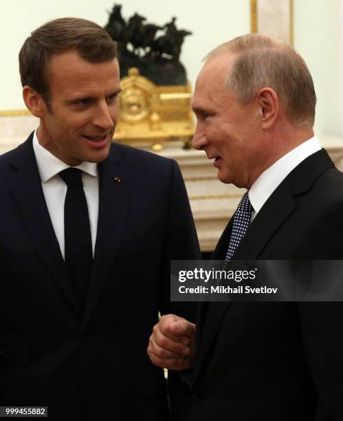 Russian President Vladimir Putin greets French President Emmanuel Macron during their talks at the Kremlin, in Moscow, Russia, July 2018. Macron has...