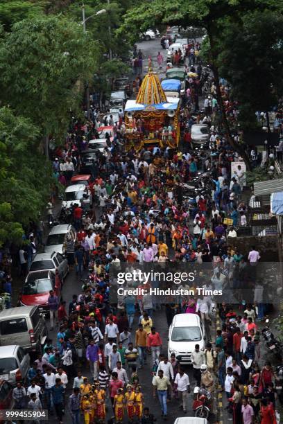 People participate in a Rath Yatra of Lord Jagannath organised by Jai Jagannath Loktaran Trust at Kharghar, on July 14, 2018 in Navi Mumbai, India....