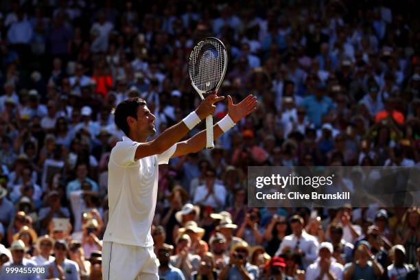 Novak Djokovic of Serbia celebrates his victory over Kevin Anderson of South Africa after the Men's Singles final on day thirteen of the Wimbledon...