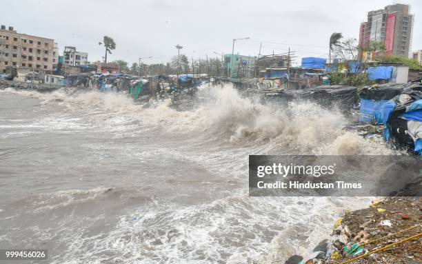 High tide waves at Versova beach, on July 14, 2018 in Mumbai, India. Mumbaikars had to face another tough battle, as the high tide hit the city at...