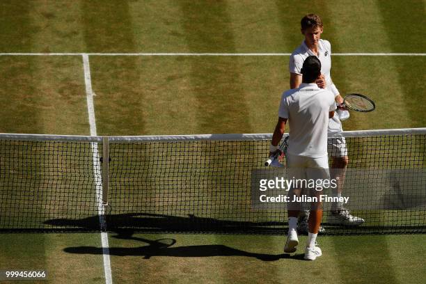Novak Djokovic of Serbia shakes hands with Kevin Anderson of South Africa after the Men's Singles final on day thirteen of the Wimbledon Lawn Tennis...
