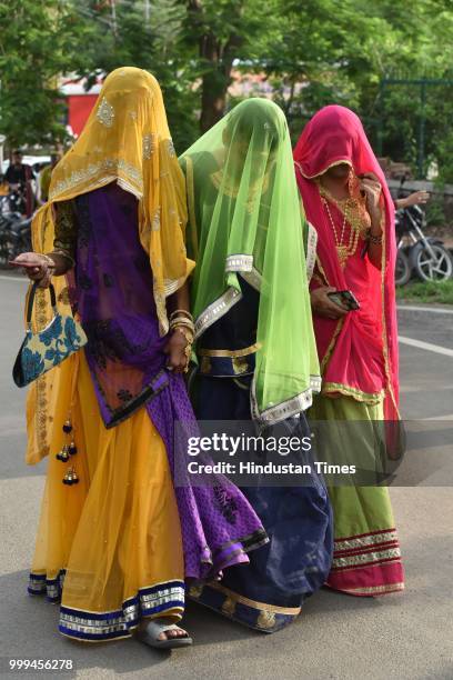 Lesbian, gay, bisexual, transgender and queer community members and supporters take part in a pride parade at Link road, on July 15, 2018 in Bhopal,...