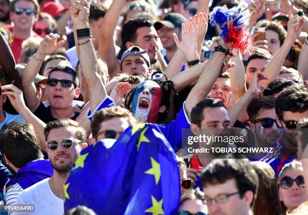 Supporter of the French team reacts during the Russia 2018 World Cup final football match between France and Croatia, at the fan zone in Berlin, on...