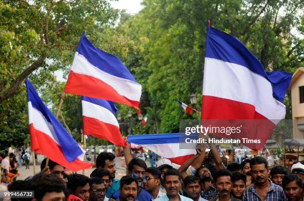 Residents of Chandannagar, a former French colony till 1950, cheer for France before FIFA World Cup Final against Croatia at Strand beside river...