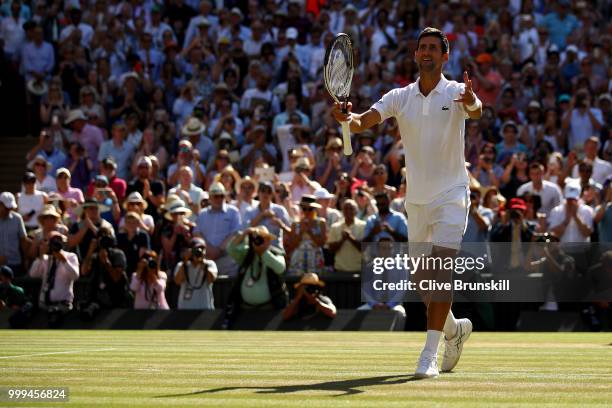 Novak Djokovic of Serbia celebrates his victory over Kevin Anderson of South Africa after the Men's Singles final on day thirteen of the Wimbledon...