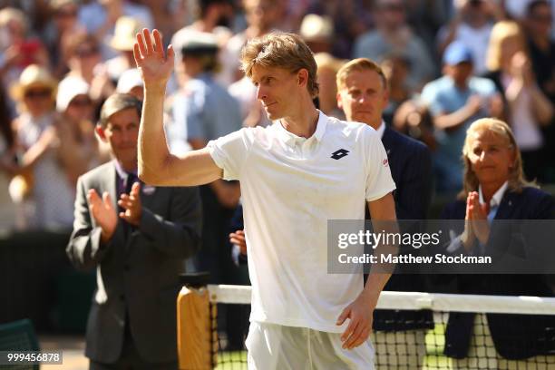 Runner-up Kevin Anderson of South Africa waves to the crowd during the trophy presentation after the Men's Singles final against Novak Djokovic of...