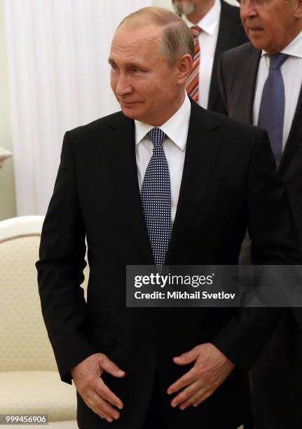 Russian President Vladimir Putin smiles during his meeting with French President Emmanuel Macron at the Kremlin, in Moscow, Russia, July 15, 2018....