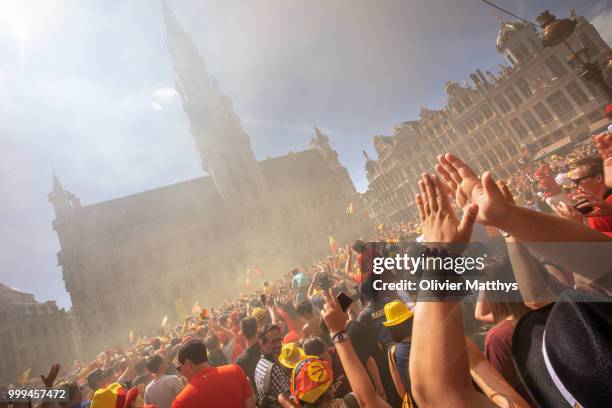 Fans cheer during the Red Devils Parade after returning from Russia at the Grand Place on July 15, 2018 in Brussel, Belgium.