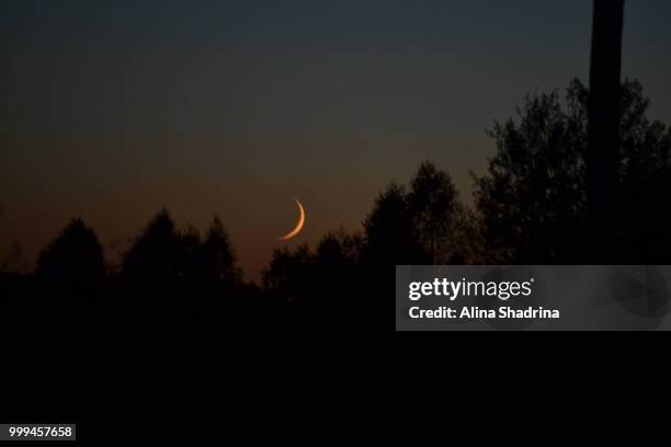 young moon in the village - alina stockfoto's en -beelden