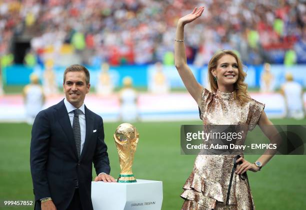Former Germany international Phillipp Lahm and Natalia Vodianova present the trophy before the FIFA World Cup 2018 final at the Luzhniki Stadium in...