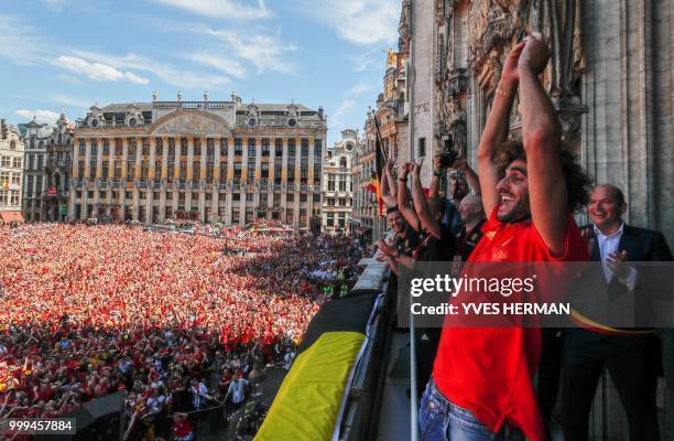 Belgium's Marouane Fellaini celebrates at the Grand Place/Grote Markt in Brussels city center, as Belgian national football team Red Devils arrive to...