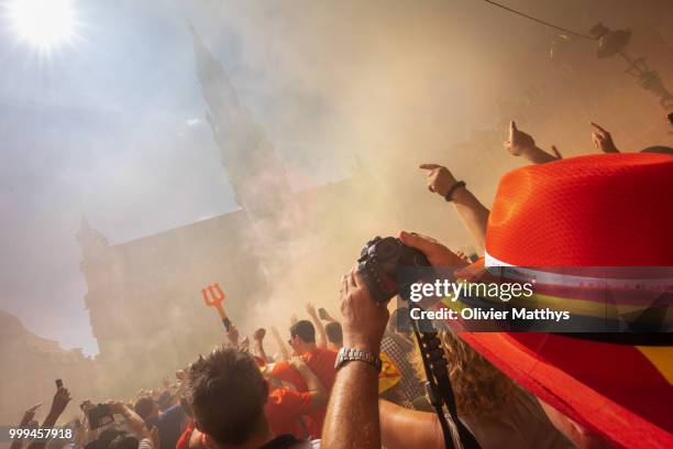 Fans cheer during the Red Devils Parade after returning from Russia at the Grand Place on July 15, 2018 in Brussel, Belgium.