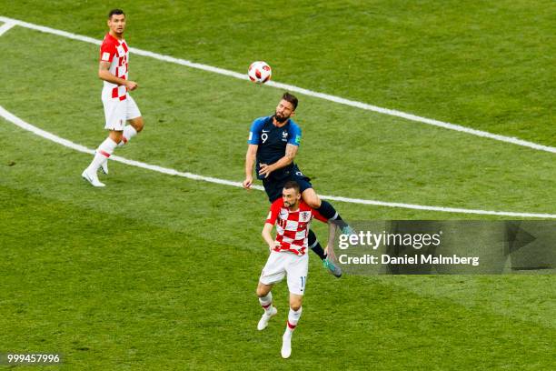 Olivier Giroud of France falls over Marcelo Brozovic of Croatia during the 2018 FIFA World Cup Russia Final between France and Croatia at Luzhniki...