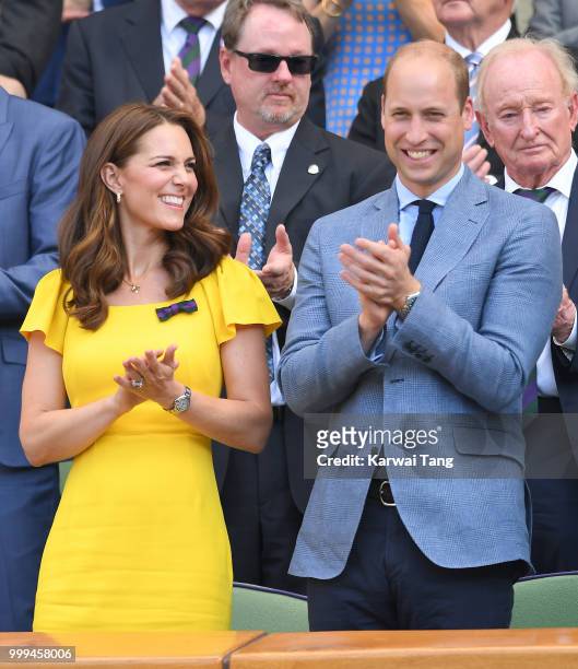Catherine, Duchess of Cambridge, Prince William and Duke of Cambridge applaud during the men's singles final on day thirteen of the Wimbledon Tennis...