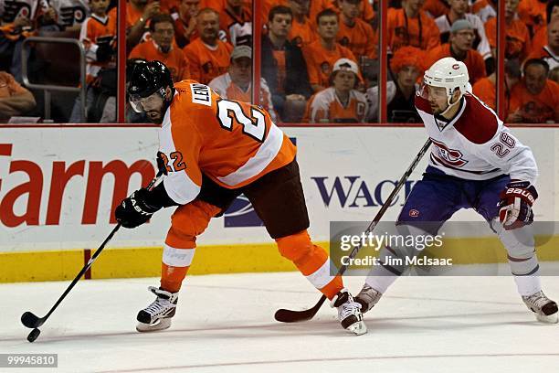 Josh Gorges of the Montreal Canadiens defends against Ville Leino of the Philadelphia Flyers in Game 1 of the Eastern Conference Finals during the...