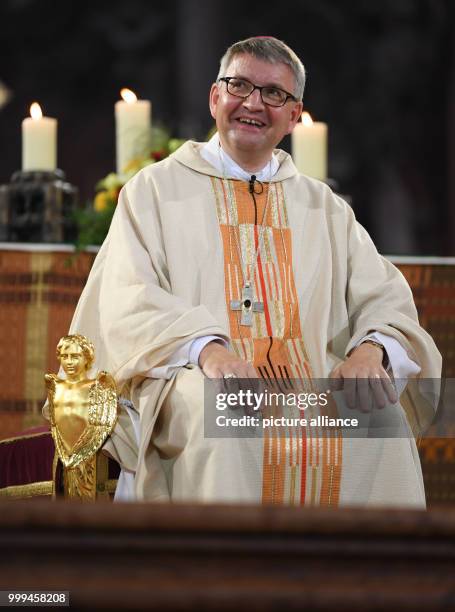 Peter Kohlgraf, new bishop of Mainz, laughs during his ordination in the Cathedral in Mainz, Germany, 27 August 2017. The 50-year-old theologian will...