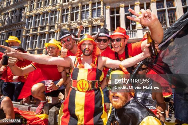 Fans cheer during the Red Devils Parade after returning from Russia at the Grand Place on July 15, 2018 in Brussel, Belgium.