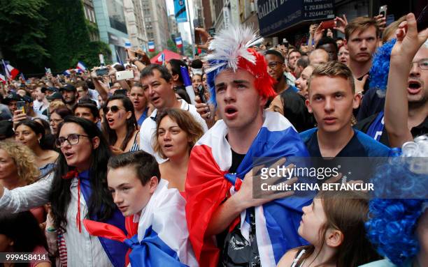 French fans sing the French National Anthem as they watch the World Cup final match between France vs Croatia on July 15, 2018 in New York. - The...