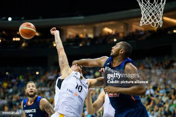 France's Boris Diaw hitting the ball away from Germany's Daniel Theis during the Germany vs France match at the Mercedes-Benz Arena in Berlin,...