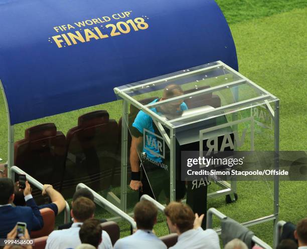 Referee Néstor Pitana consults VAR before awarding a penalty kick to France during the 2018 FIFA World Cup Russia Final between France and Croatia at...