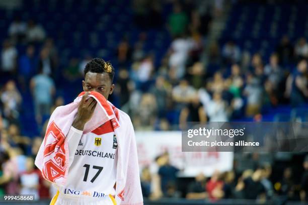 Germany's Dennis Schroder walking on the court alone after his team's defeat against France during the Germany vs France match at the Mercedes-Benz...