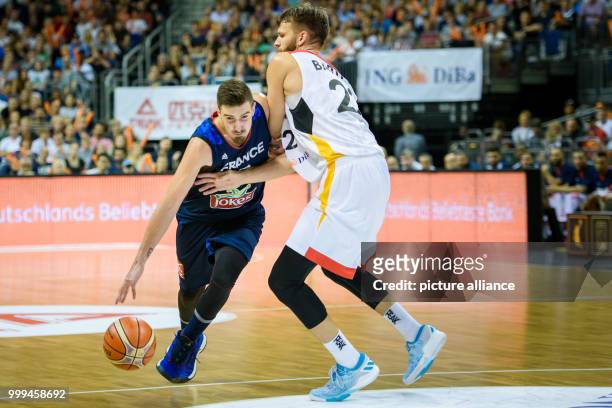 France's Nando De Colo overcoming Germany's Danilo Barthel during the Germany vs France match at the Mercedes-Benz Arena in Berlin, Germany, 27...