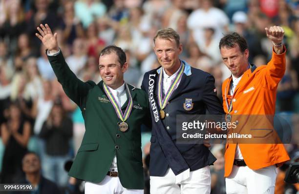 The Irish show jumper Cian O'Connor , Sweden's Peder Fredricson and the Netherland's Harrie Smolders stand on the podium after the single show...