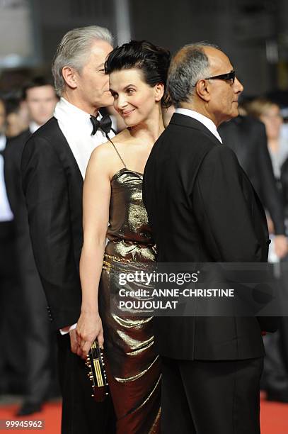 British actor William Shimell, French actress Juliette Binoche and Iranian director Abbas Kiarostami arrive for the screening of "Copie Conforme...