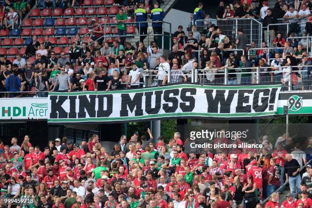 Hannover's fans put up a banner saying 'Kind muss weg' before the beginning of the German Bundesliga soccer match between Hannover 96 and FC Schalke...
