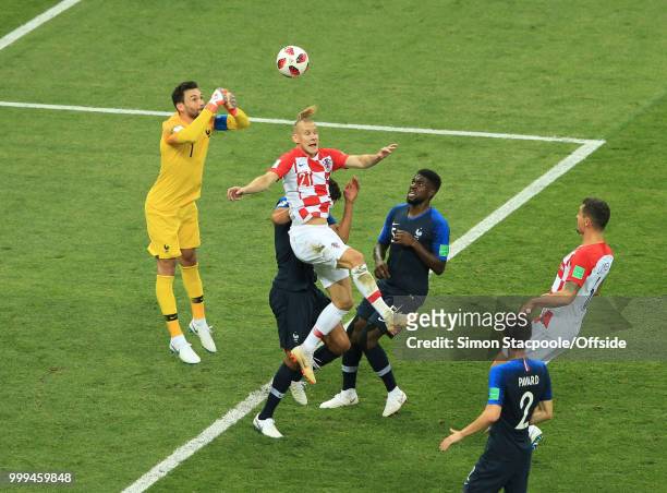 France goalkeeper Hugo Lloris punches clear from Domagoj Vida of Croatia during the 2018 FIFA World Cup Russia Final between France and Croatia at...