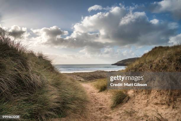 beautiful landscape image of freshwater west beach with sand dun - dun stock pictures, royalty-free photos & images