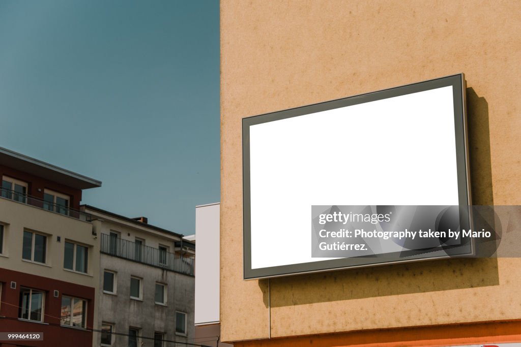 Blank billboard on building facade