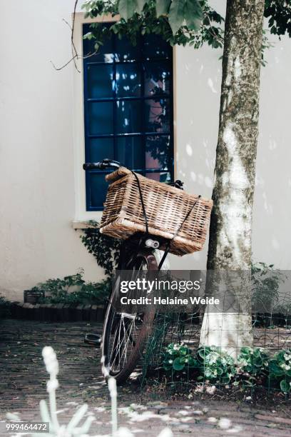 bicycle in front of a house - weide stock pictures, royalty-free photos & images