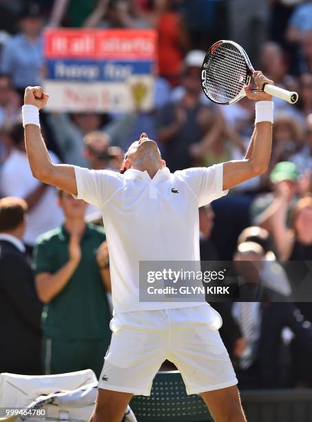 Serbia's Novak Djokovic celebrates after beating South Africa's Kevin Anderson 6-2, 6-2, 7-6 in their men's singles final match on the thirteenth day...